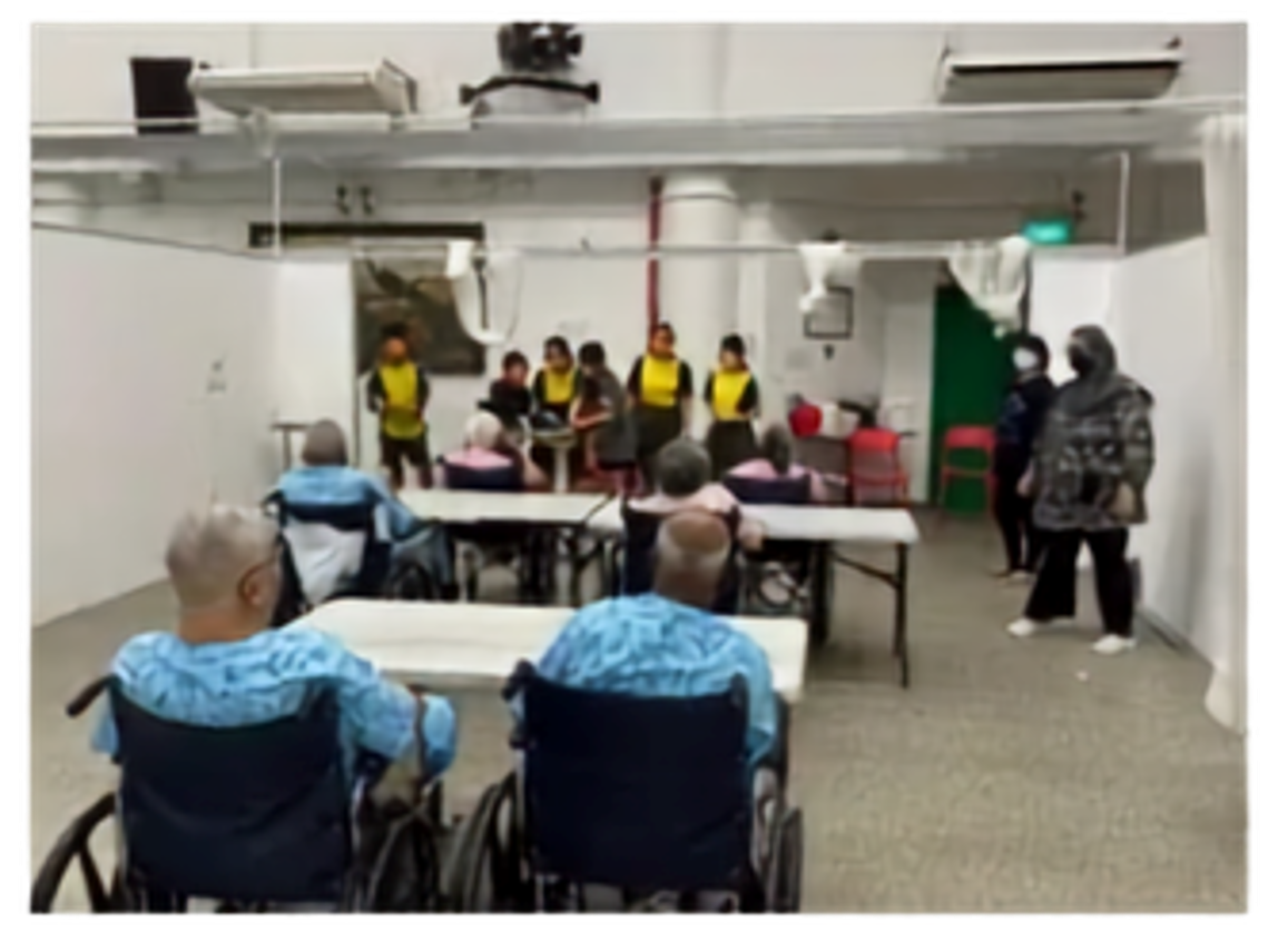Secondary 2 students engaging in interactive games with the residents of Sree Narayan Mission Home, fostering intergenerational bonding and community spirit.